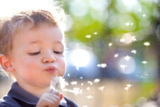 Child blowing bubbles