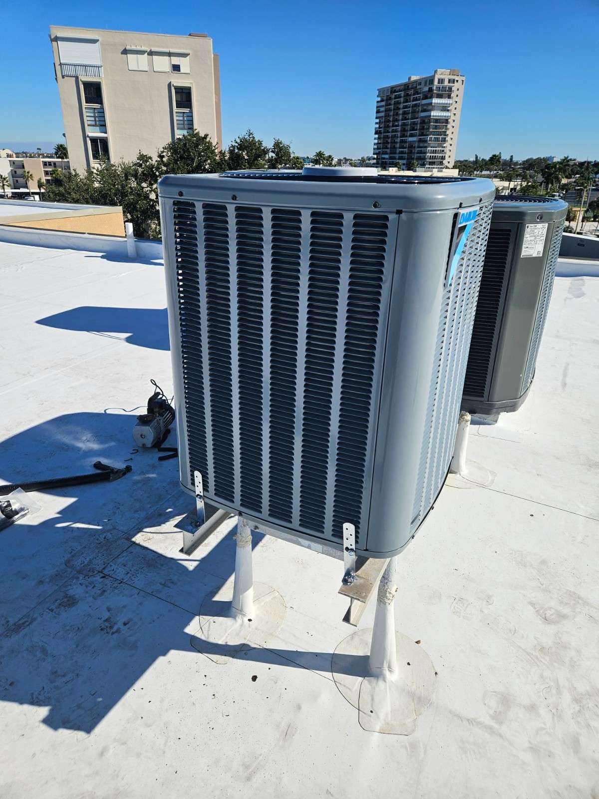 Heat pump condenser installed on a flat roof