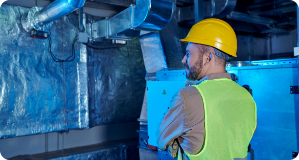 Technician installing humidifier and dehumidifier ductwork
