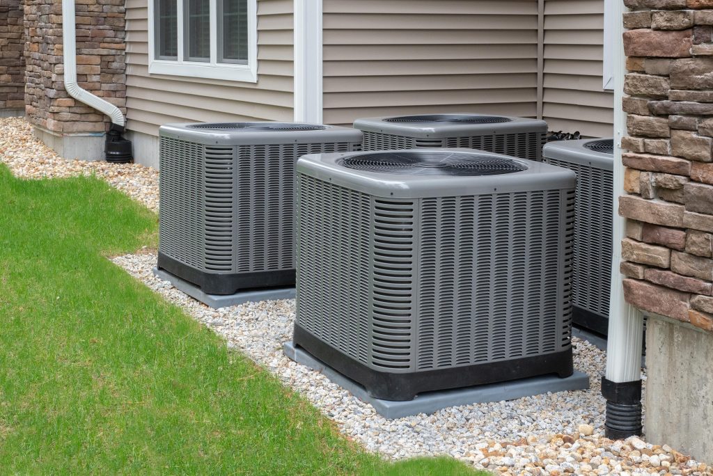 New air conditioning condensers installed beside a Pinellas County, FL home
