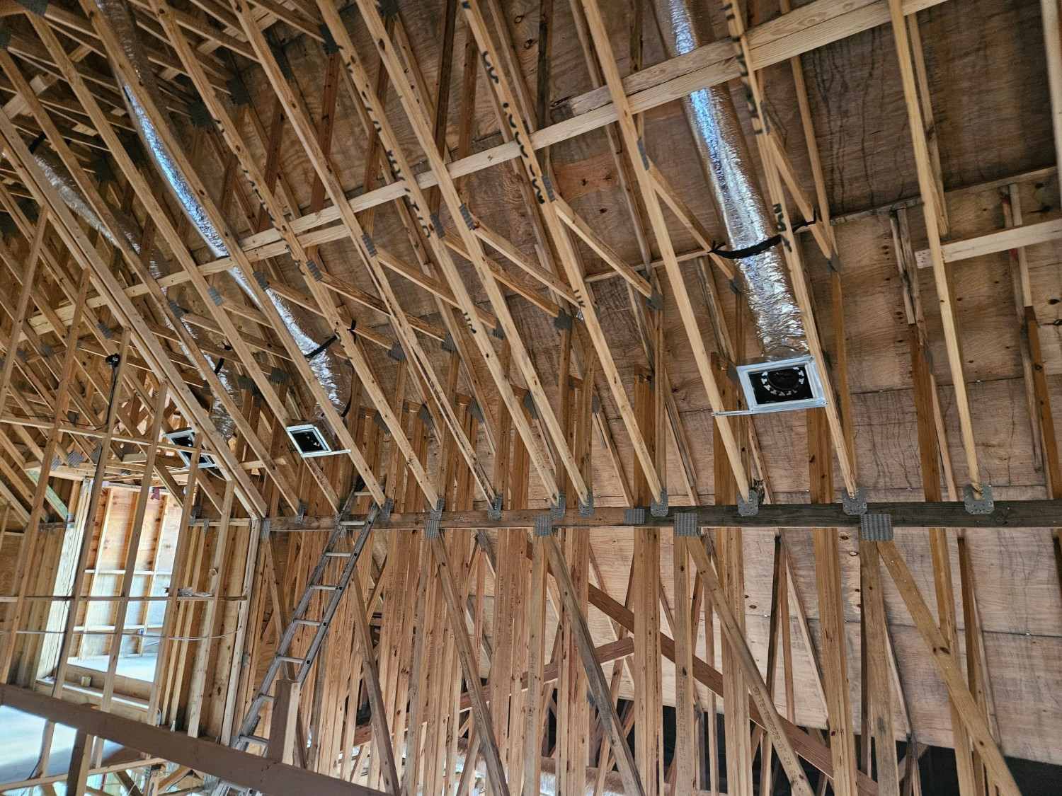 New ductwork installed through attic framing