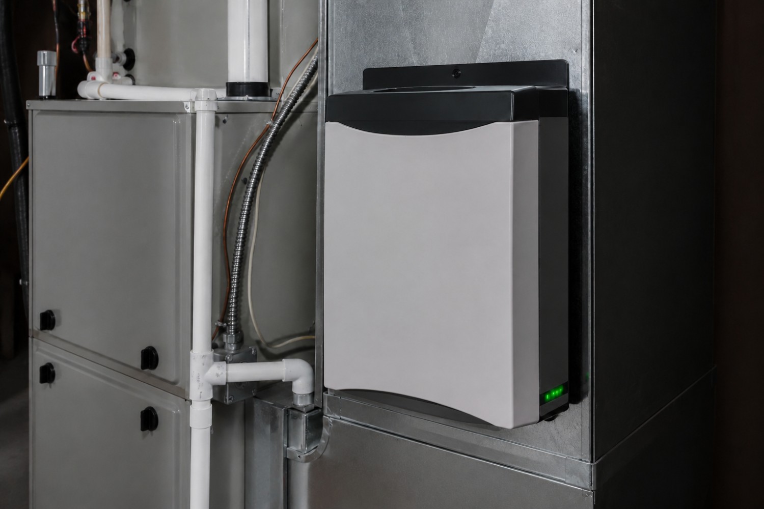 Whole-home air purifier installed beside the indoor air handler of a Pinellas County, FL home