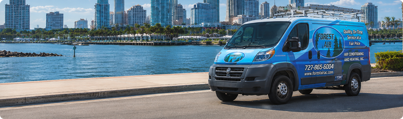 Forest Air service van on the St. Petersburg, FL waterfront with the downtown skyline behind it